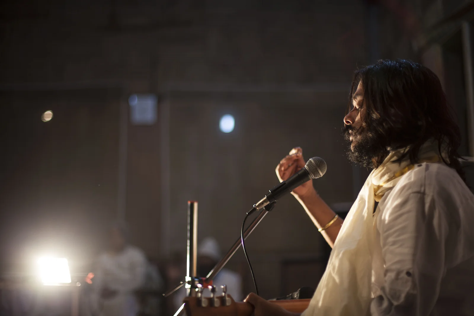 Prem Paras sharing music at a microphone during a past gathering