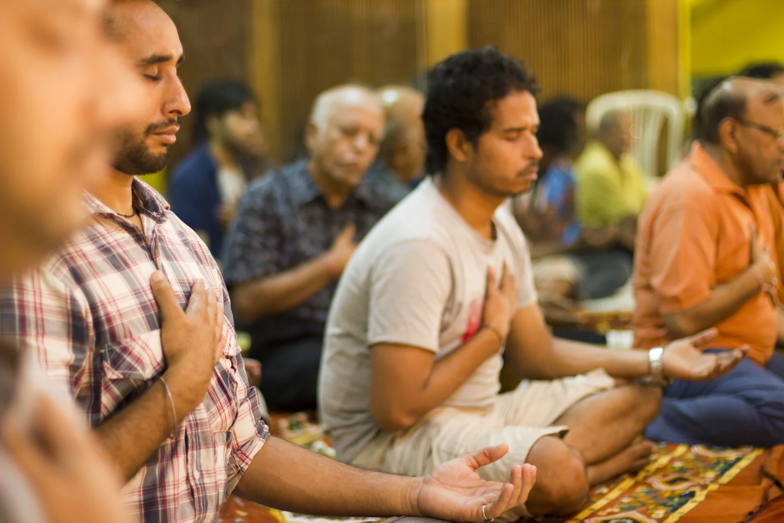 Participants sitting in meditation at a past gathering